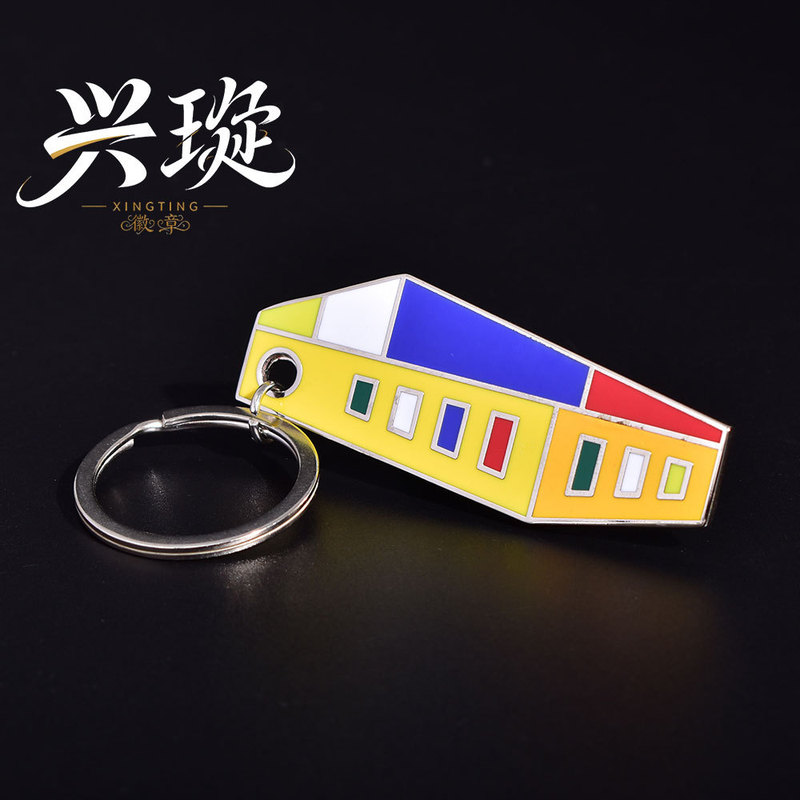 Customized metal keychain with geometric enamel pendants featuring scenic architecture, a creative souvenir for urban cultural tourism