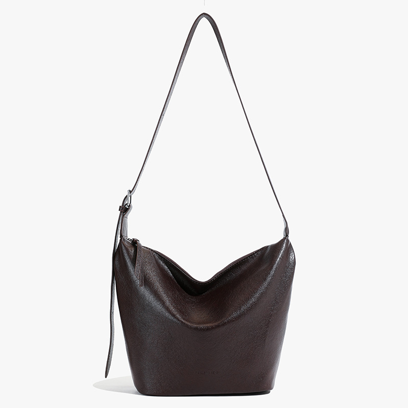 Bolsas de textura retro de estilo universal para mujeres de gran capacidad 2025 nuevo estilo universal bolsas de cubo de hombro nicho bolsas de bolsas de饺os de viaje