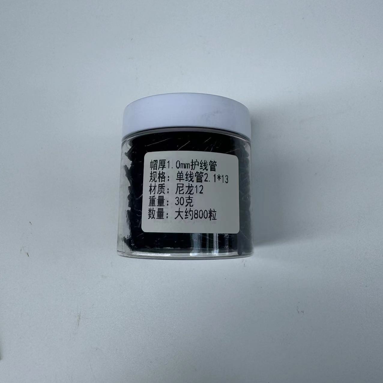 Boutique raqueta de bádminton partículas de goma nueva línea de alta calidad protector de uñas de alambre de línea única línea doble manga negro