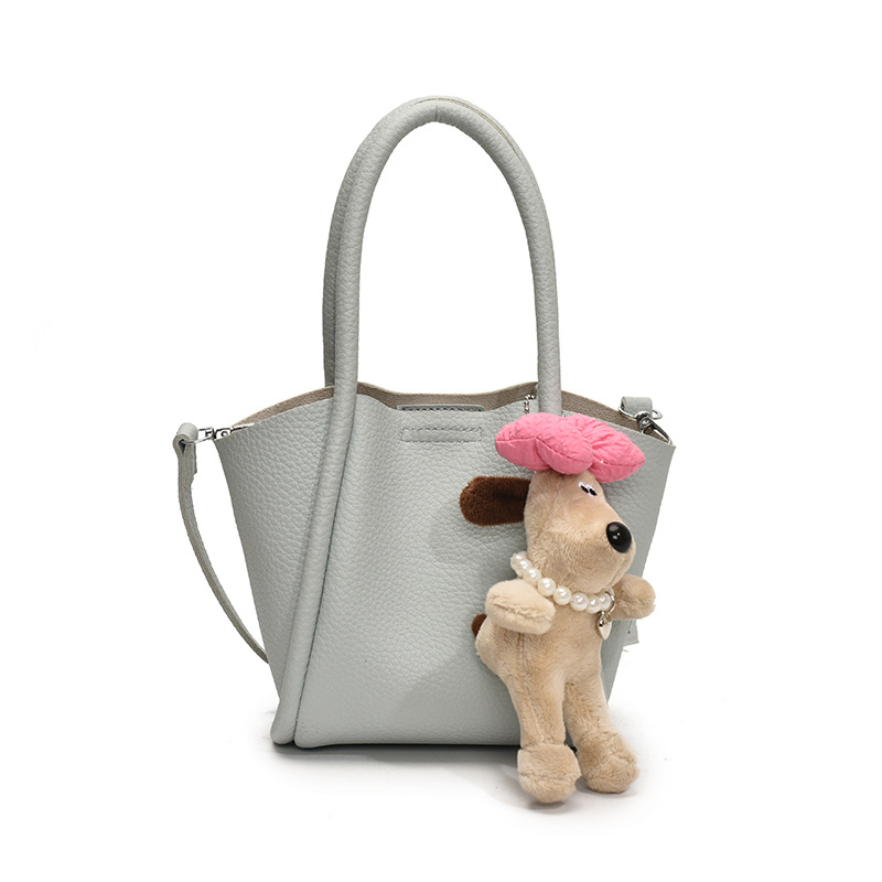 Bolso de cubo de mano de estilo explosivo transfronterizo para mujer 2025 nuevo bolso de hombro de alta gama de nicho bolso de cesta de verduras de moda coreana