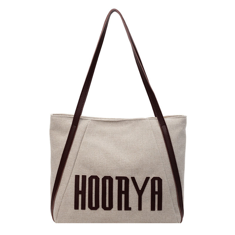 Bolsa de lona de gran capacidad para viajes 2025 nueva bolsa de mujer bolsa de hombro casual estilo exterior versátil bolso universitario