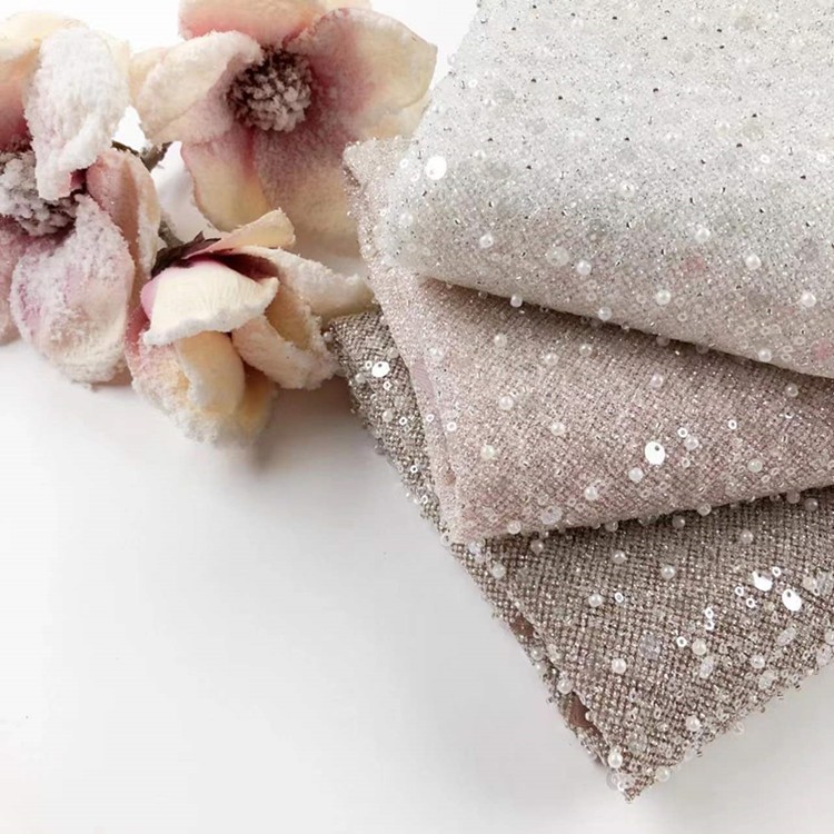Fabricantes de comercio exterior transfronterizo punto bordado de polvo de polvo brillante tela vestido de boda ropa de moda tela