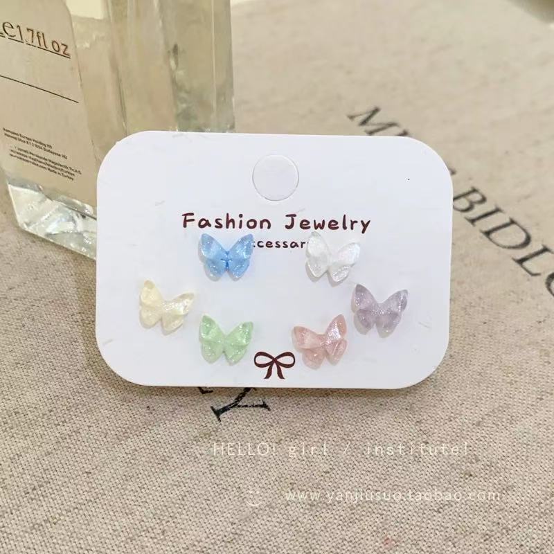 Pendientes redondos de color de aguja de plata Pendientes frescos y dulces Pendientes de todo fósforo de moda simple para mujer