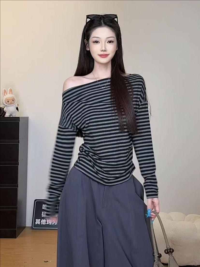 Primavera y otoño una sensación de relajación del hombro delgada chica caliente estilo rayas camiseta de manga larga de estilo coreano de mujer perezosa camiseta de hombro inclinada