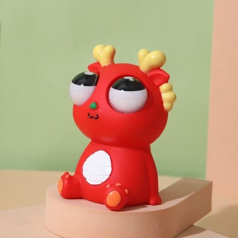 新商品の創意的な爆眼龍恐竜龍年の解凍玩具のつまみと音楽をつぶして目をむいておかしく発散します。|undefined