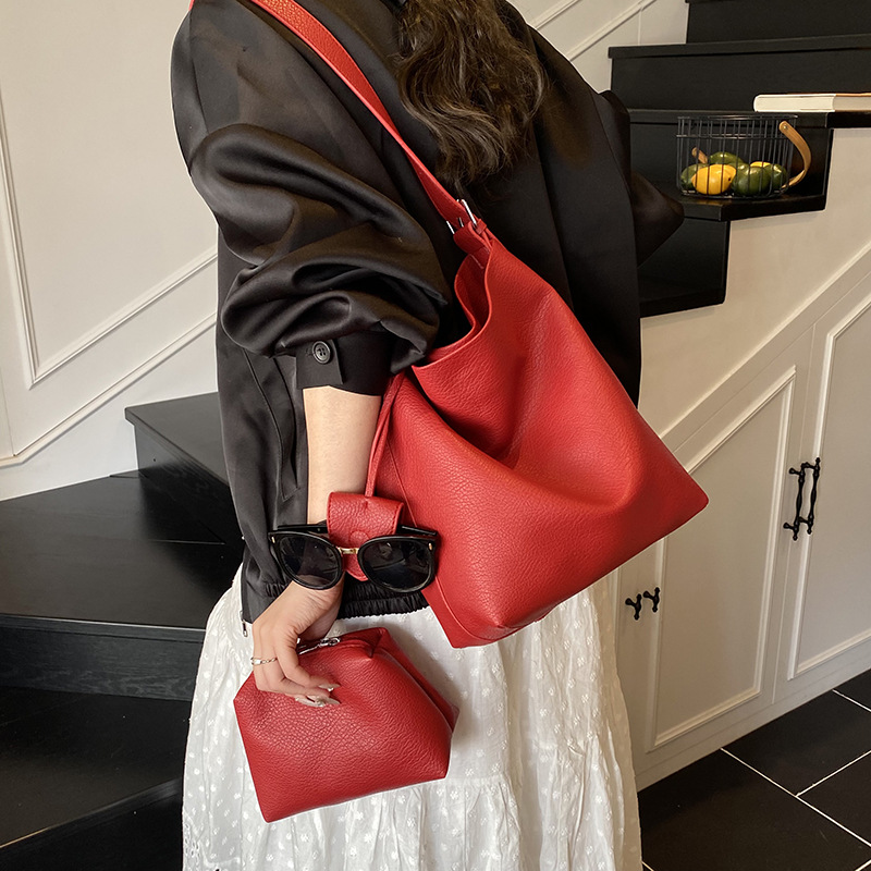 Bolso de cubo de mano de moda de comercio exterior para mujer 2025 nuevo bolso de hombro simple de venta caliente versión coreana bolso casual de alta gama