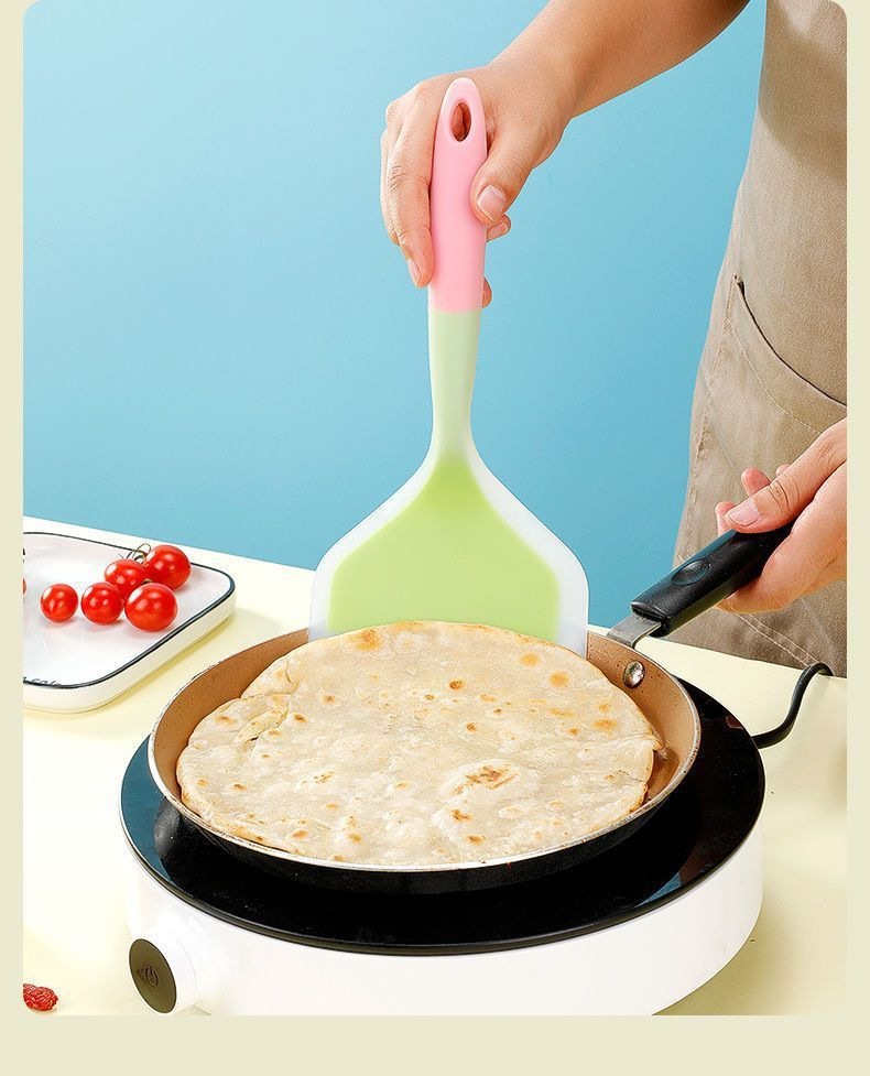 Silicone Spatula Wide Head Pancake Turner Heat Resistant Kitchen Flipper with Oil Brush for Nonstick Cookware in use