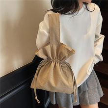 小众轻便休闲手提布包便携抽绳包包女式时尚手腕包外出遛弯手机包