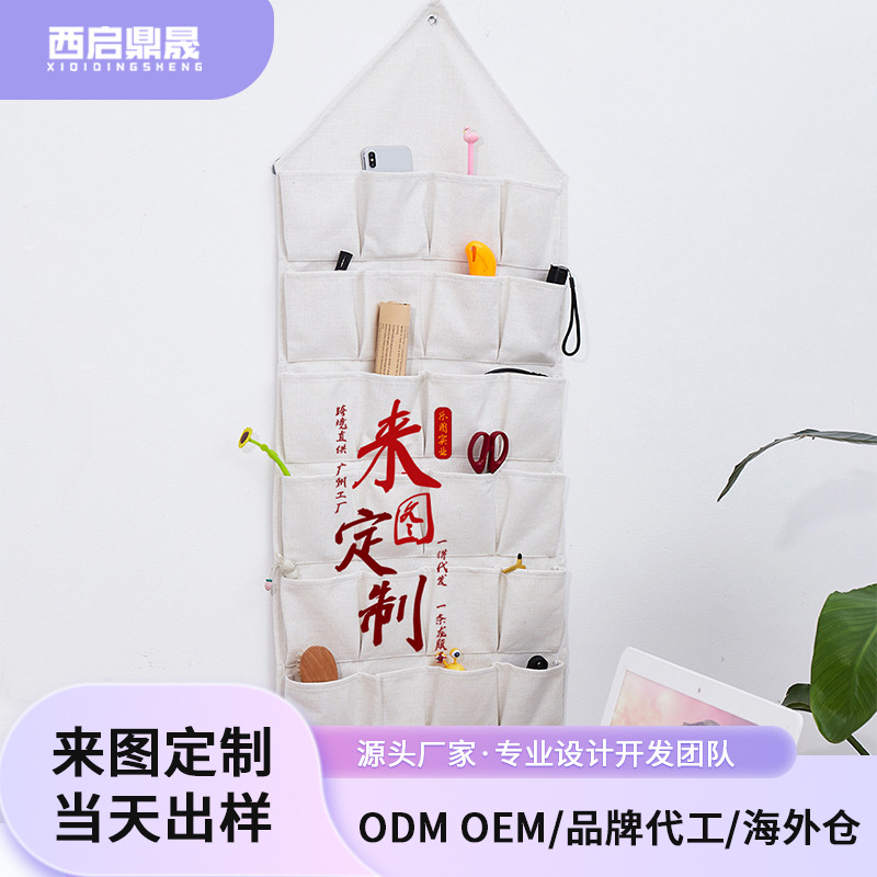 La imagen se puede fijar en la pared triángulo perforado bolsa de almacenamiento de algodón y lino que organiza la sala de estar bolsa de almacenamiento de artículos diversos detrás de la puerta