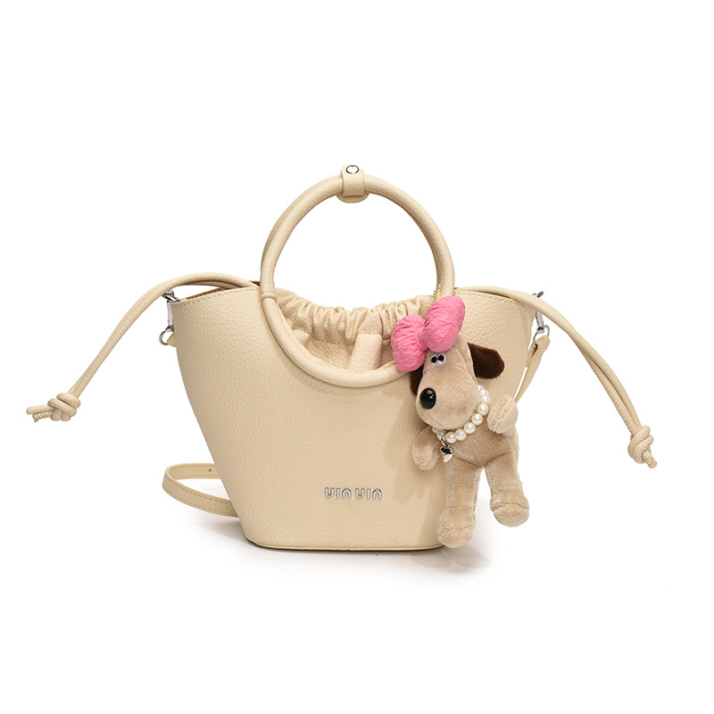 Bolsos de mano de nicho de tendencia transfronteriza para damas 2025 nuevo bolso de hombro simple de moda con textura bolso de cubo de todo fósforo