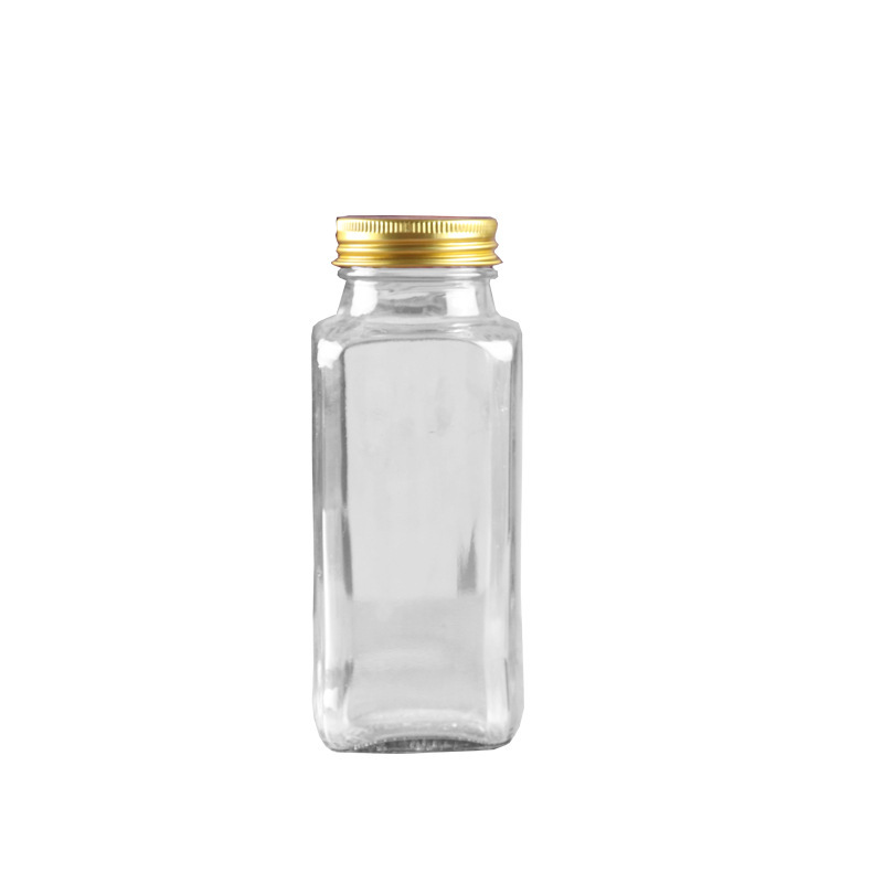 Botella de condimento de vidrio transparente cuadrada sellada cubierta abierta botella de condimento de cocina botella de condimento fábrica directa