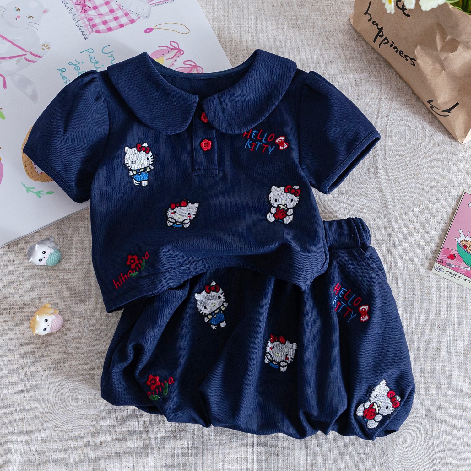 女の子の夏のスーツ2025の新型の洋気の子供のかわいい漫画のプリントの半袖のtシャツの格子のつぼみのスカート