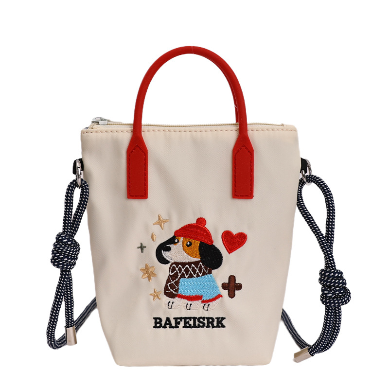 2026 nuevo estilo de alto nivel de sentido perezoso viento bordado portátil tipo cubo bolso de teléfono móvil lindo tela de nylon de color sólido mochila