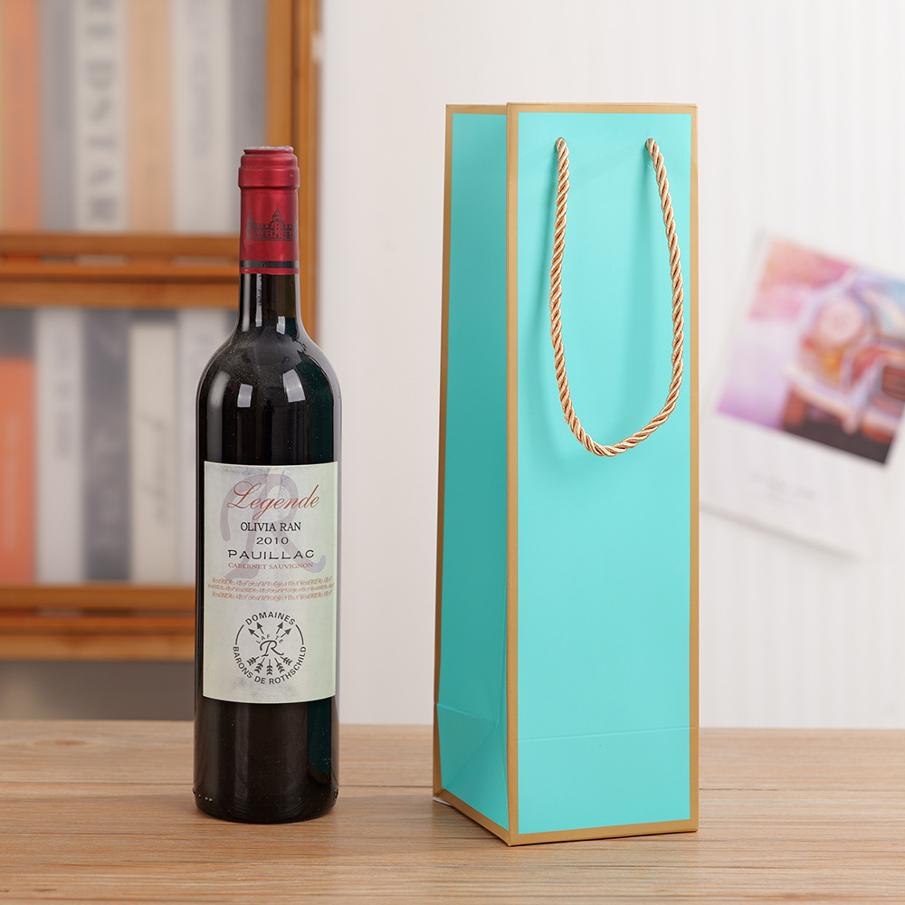 現物の高級ワインの手提げ袋は、シングルワインのギフト包装袋の紙袋を厚くしてロゴを印刷することができる