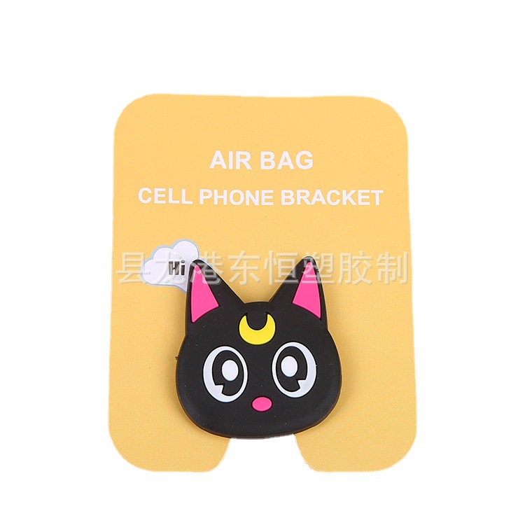 En stock al por mayor TikTok Cartoon creativo soporte de teléfono móvil puede soportar airbag soporte de teléfono móvil soporte de escritorio