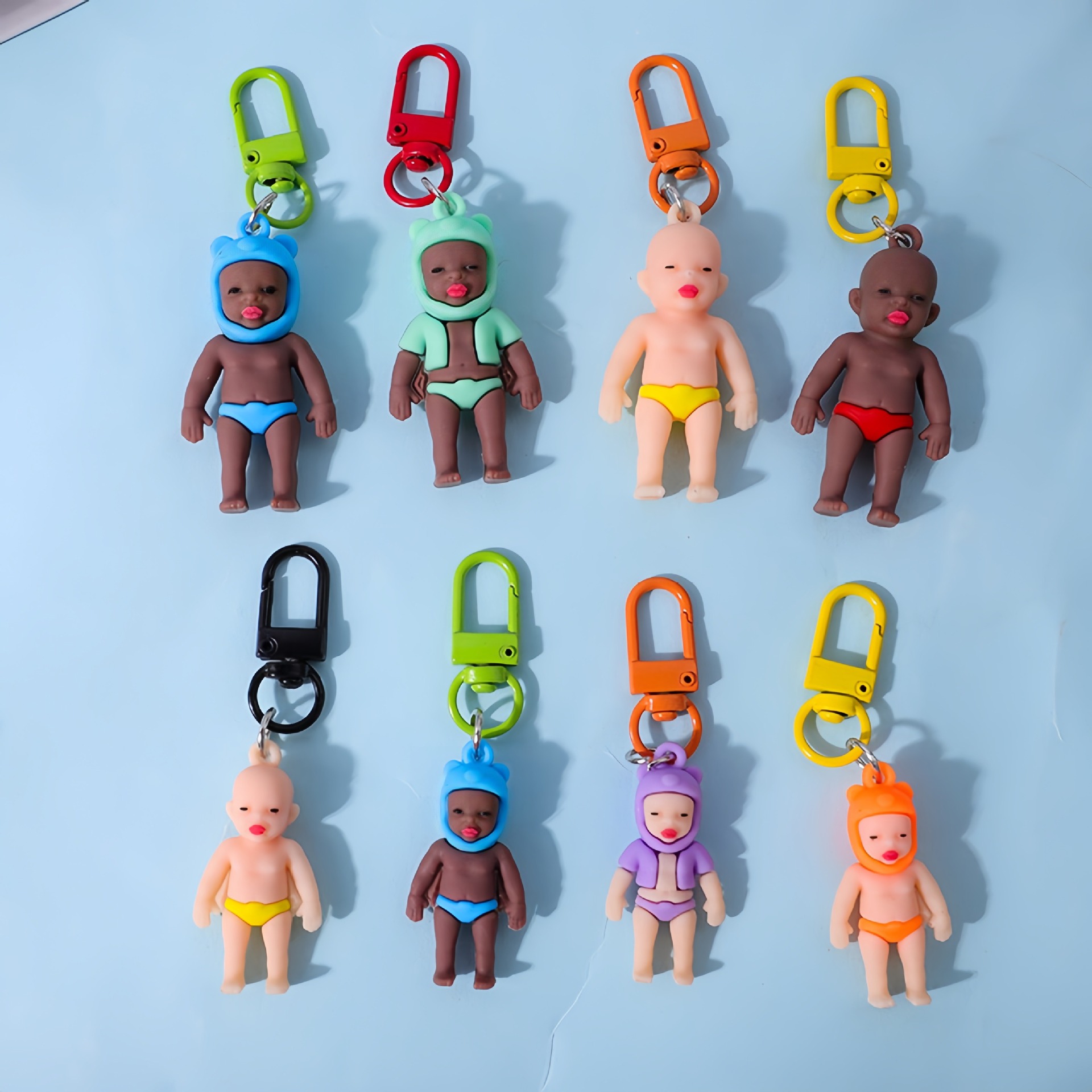 Bloqueo negro Baby decolor llavero colgante de automóvil decolor UV creativo accesorios de muñeca al por mayor