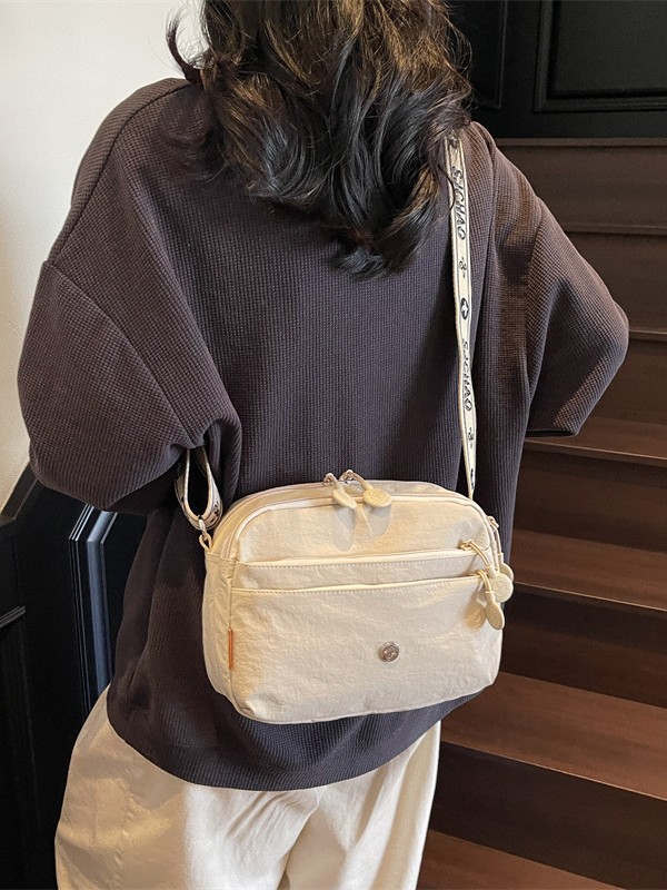 Oxford tela ligera bolsa casuales para mujeres 2025 nuevo estilo simple de moda textura de viaje mochila de hombro
