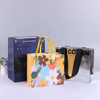 白卡手提纸袋定制化妆品服装礼品包装袋牛皮手提袋可印logo