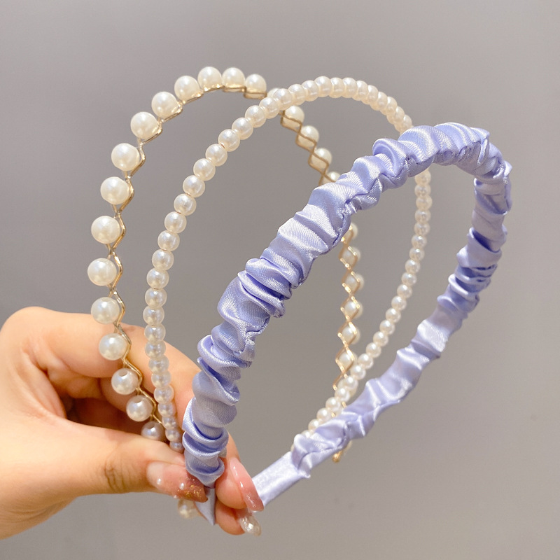 A principios de la primavera, la banda de cabello para mujeres en línea, 2025 nuevo lavado de cara de presión de tarjeta de cabello para el cabello, banda de cabello de perlas, banda de cabello para mujeres.