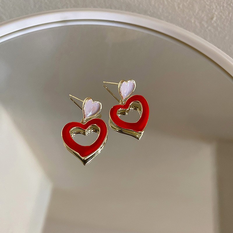 Aguja de plata Pendientes de amor exagerados europeos y americanos Pendientes de lujo ligero de alta calidad Pendientes de temperamento de metal de moda de nicho para mujer al por mayor