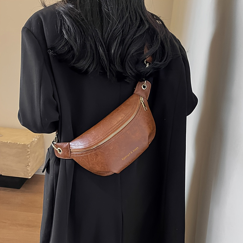 Bolso de diseño de nicho para mujeres versátil 2025, nuevo bolso de hombro de banda ancha para mujeres, bolso de pecho, bolso de cintura.