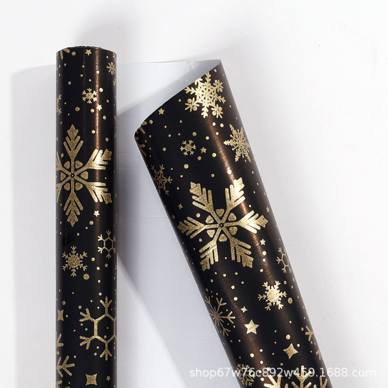 Rollo de papel de regalo de Navidad transfronterizo paquete de tubo de papel de regalo de árbol de Navidad de copo de nieve de oro negro rollo de gran tamaño sentido avanzado