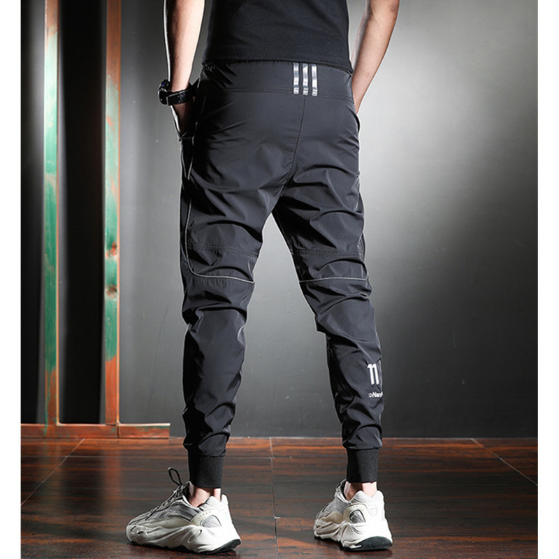 Pantalones deportivos casuales pantalones de secado rápido de cintura elástica fresca de estilo fino de verano para hombres