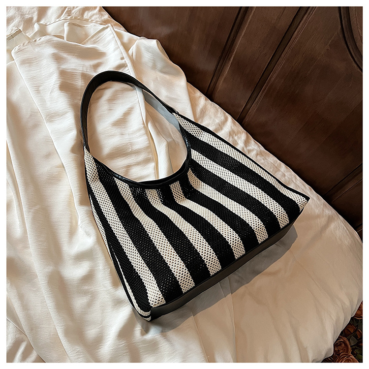 Korean summer new striped woven bag, casual vacation and laid-back style tote bag, hand and shoulder commuter tote bag undefined
