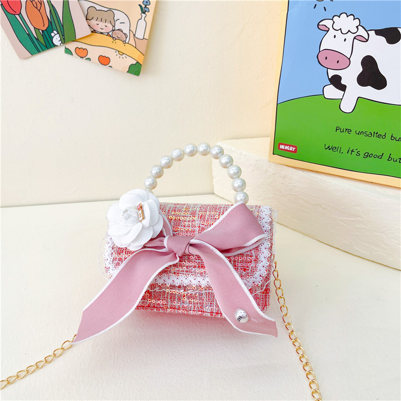 Bolso de los nuevos niños al por mayor bolso de princesa Linda pequeña flor arco accesorios bolsa versátil bolsa de mensajero de las muchachas