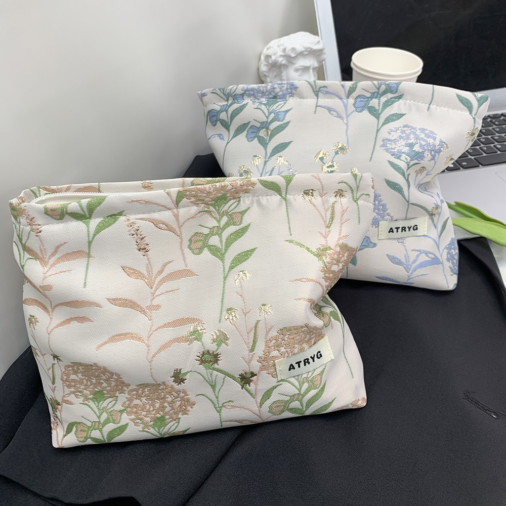 Bolsa de maquillaje, una pequeña bolsa fresca portátil de gran capacidad, bolsa de almacenamiento para productos de cuidado de la piel, bolsa de mano.