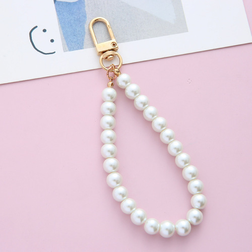 Retro trendy brand pearl key chain wholesale antique simple small pendant alloy key chain mobile phone chain bag pendant