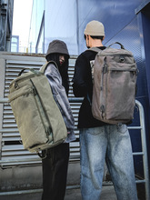 时尚男包大容量旅行双肩包男士户外旅游运动圆筒背包潮流帆布书包