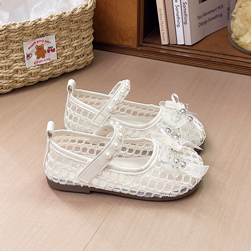 Niñas sandalias de arco de perla 2026 verano nuevo niño bolso de dibujos animados hueco princesa sandalias zapatos de playa
