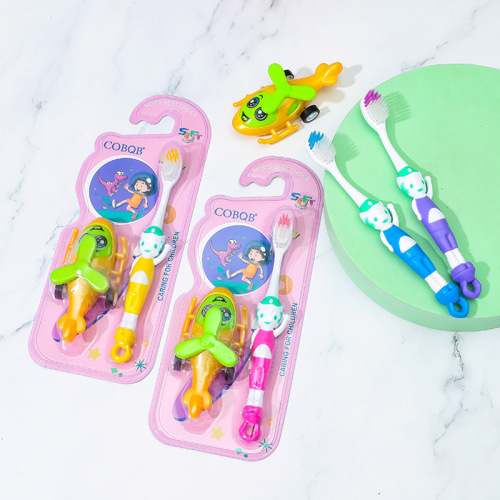 Children's toothbrush with toy cartoon packaging foreign trade export street stall 2 yuan store baby toothbrush soft bristles wholesale manufacturer