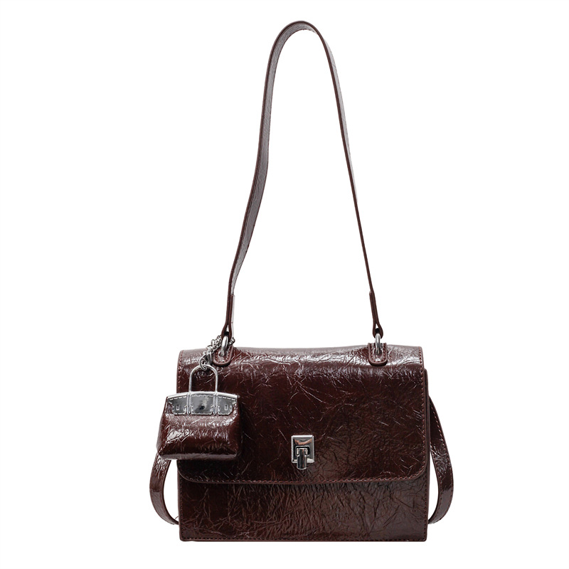 Bolso de textura transfronteriza 2025 primavera y verano nuevo bolso femenino bolso de hombro con patrón de agarre de mano de alta gama bolso de mensajero simple y versátil