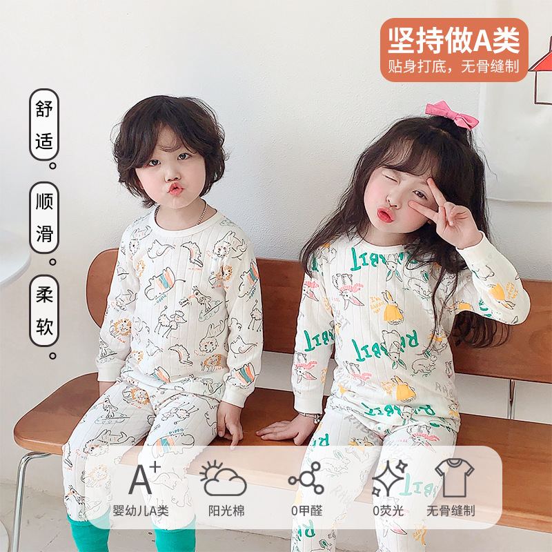 Ropa de casa estilo otoño-invierno para niños mayores, pijamas de algodón puro sin costuras, conjunto de camiseta de manga larga y pantalones, diseño sin costuras.