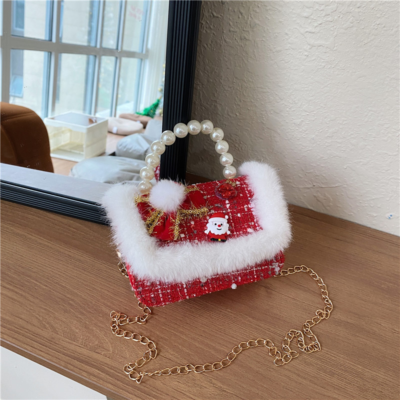 Mini moda para niñas bolso de cambio de perlas 2024 nuevo patrón de moda coreana bolso de ropa infantil