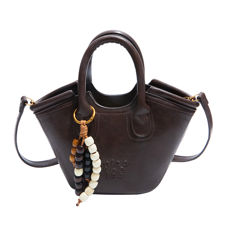 Bolsa de aire coreana para mujeres 2025, otoño y invierno, nuevo estilo de alta calidad, bolso de cubo portátil, bolso de hombro para viajar.