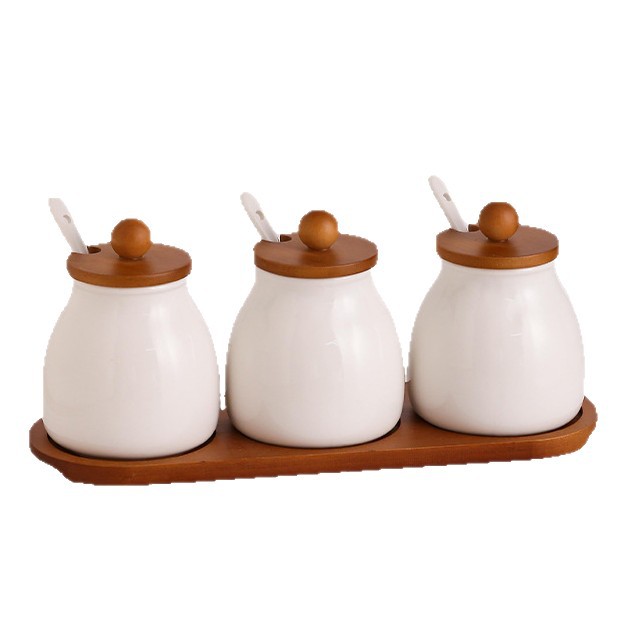 Tanque de condimento de cocina caja de condimento doméstica lata de sal botella de condimento de cerámica lata de condimento combinación conjunto de frasco de arroz y frasco de arroz