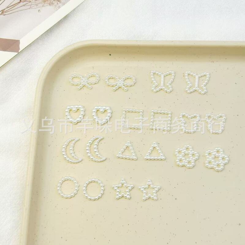 Hollow pearl sweet white moon bow love five-pointed star three-dimensional nail decoration accessories wholesale