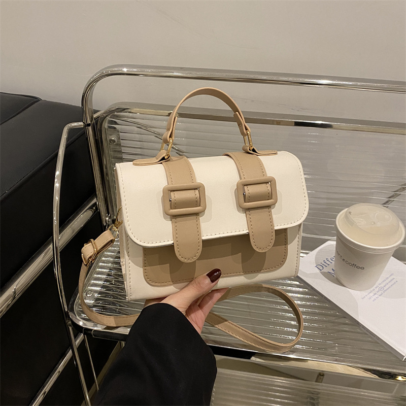 Bolsa de hombro de invierno de color extranjero para mujeres 2024 nueva moda mochila de tela de empalme elegante bolso de mano