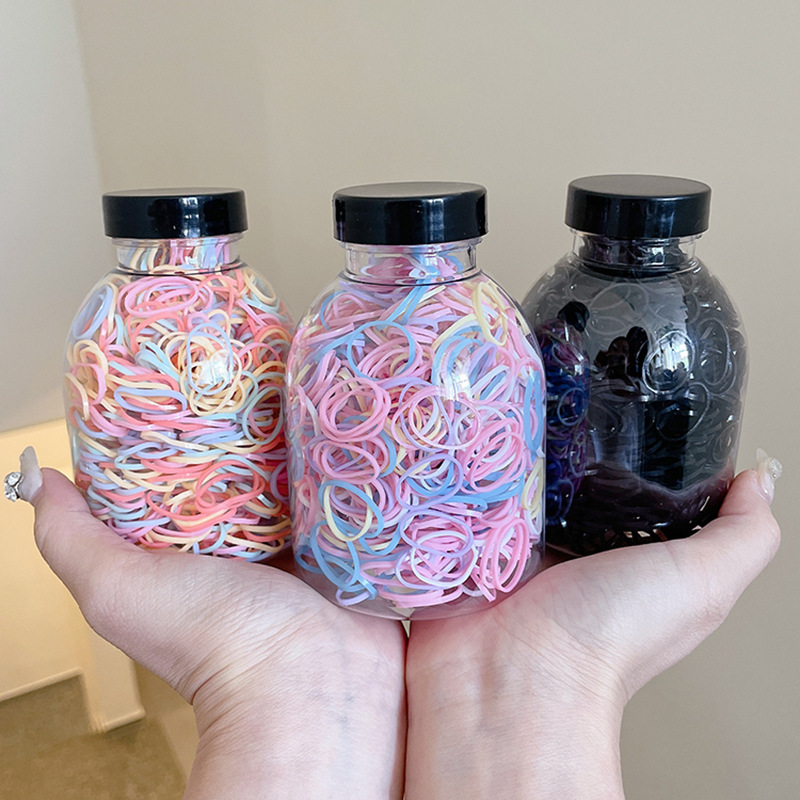 Las bandas de goma desechables de color para niños no dañan el cabello, alta elasticidad y durabilidad