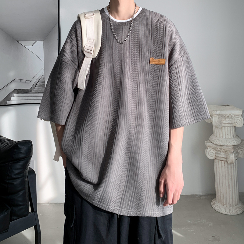 Camiseta de manga corta de verano de Hong Kong Tide para hombres inins coreanos sueltos versátiles Jacquard camiseta de cuello redondo de marca de marea chaqueta transpirable