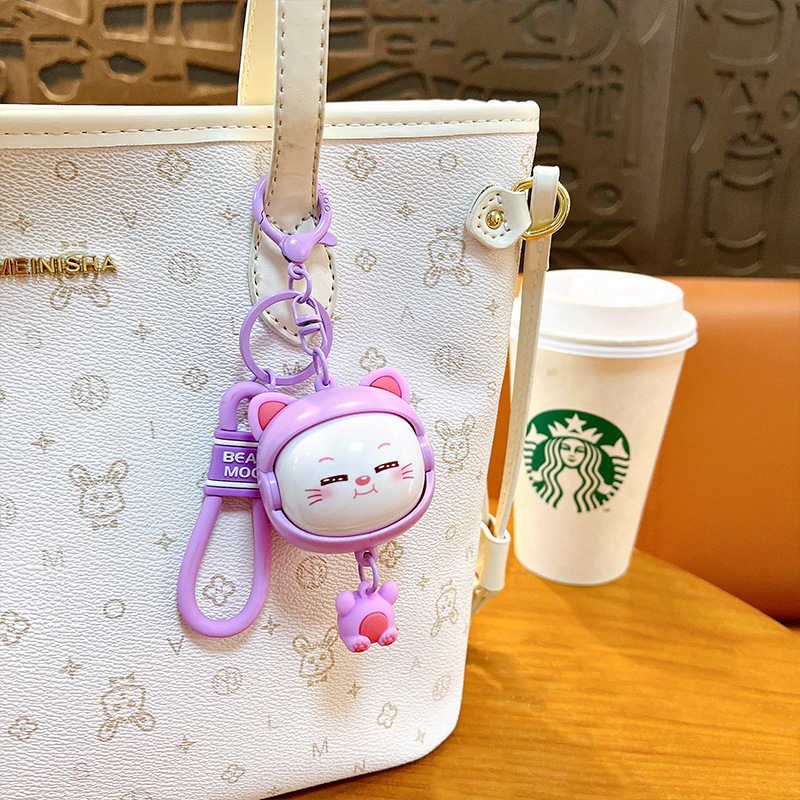 Llavero creativo de dibujos animados girando música lindo descompresión cambio de cara llavero de gato bolsos para hombres y mujeres pequeños regalos al por mayor