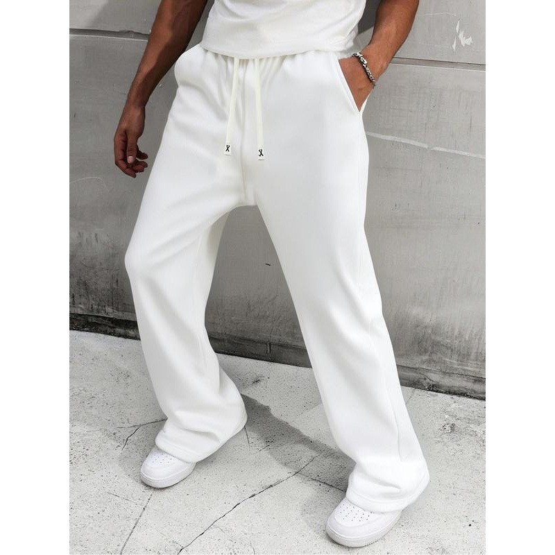 Pantalon de survêtement homme uni à jambes larges, coupe ample et décontractée, cordon de serrage, style sportif, jambes droites._voghion.com