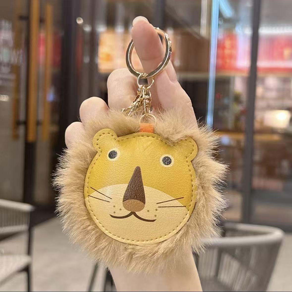 Transfronterizos peluche extraño león llavero de cuero bolsos de pareja colgante lindo llavero de automóvil pequeño regalo
