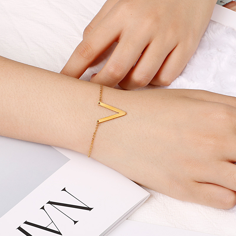 Fashionable golden bracelet with letters stainless steel
