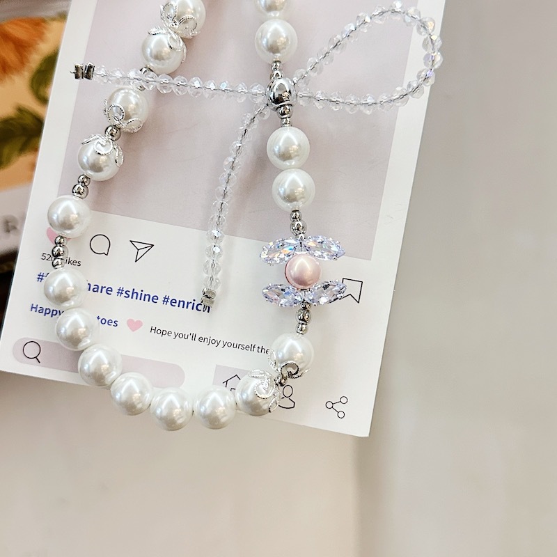 Boutique hecho a mano de alta gama cadena de teléfono móvil cadena de pulsera de perlas de tres colores cordón de teléfono móvil de moda colgante de mensajero largo