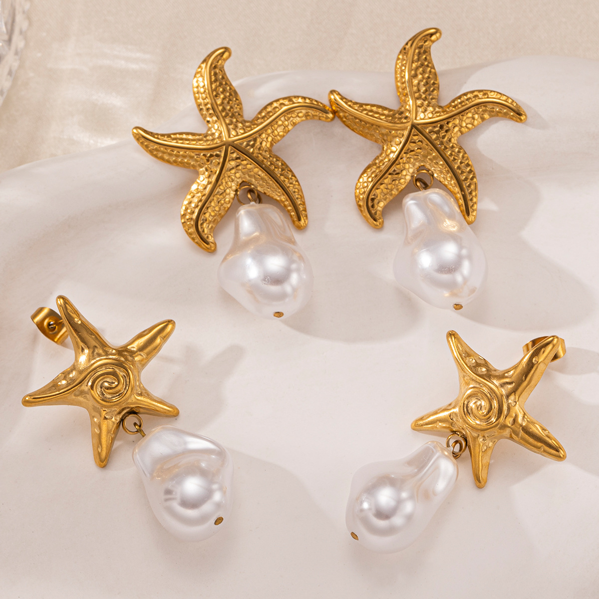 Pendientes de acero inoxidable europeo y americano de Tena Pendientes de estrella de mar de playa de mar de lujo ligero Pendientes de perlas reales estilo de vacaciones