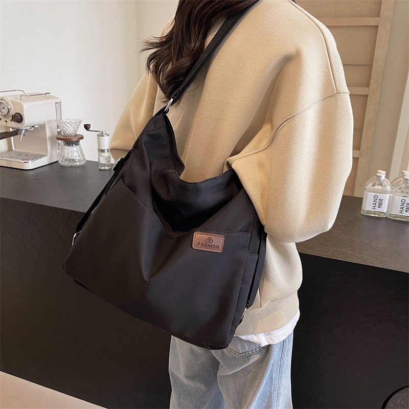 Nueva mochila multifuncional para mujer, bolso de viaje de textura de moda, bolso de mensajero, mochila de nailon de gran capacidad, bolso de hombro